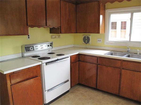 10 Stacy Street Randolph, MA 02368 - Photo 4 of 8 a utility room with sink dryer and washer