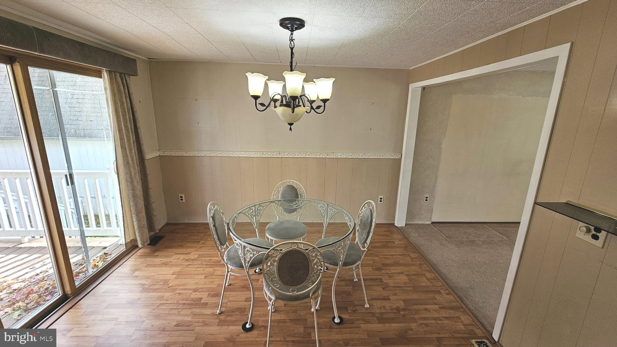 53 Crosswicks Chesterfield Road Chesterfield, NJ 08515 - Photo 11 of 35 a dining room with furniture a chandelier and wooden floor