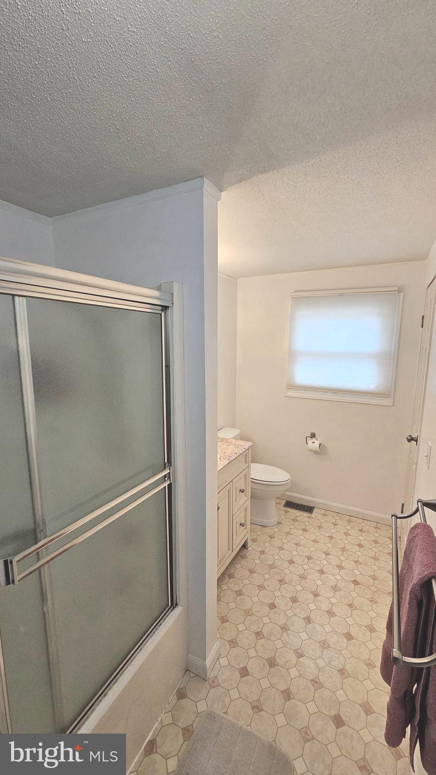 53 Crosswicks Chesterfield Road Chesterfield, NJ 08515 - Photo 12 of 35 a bathroom with a toilet and a shower