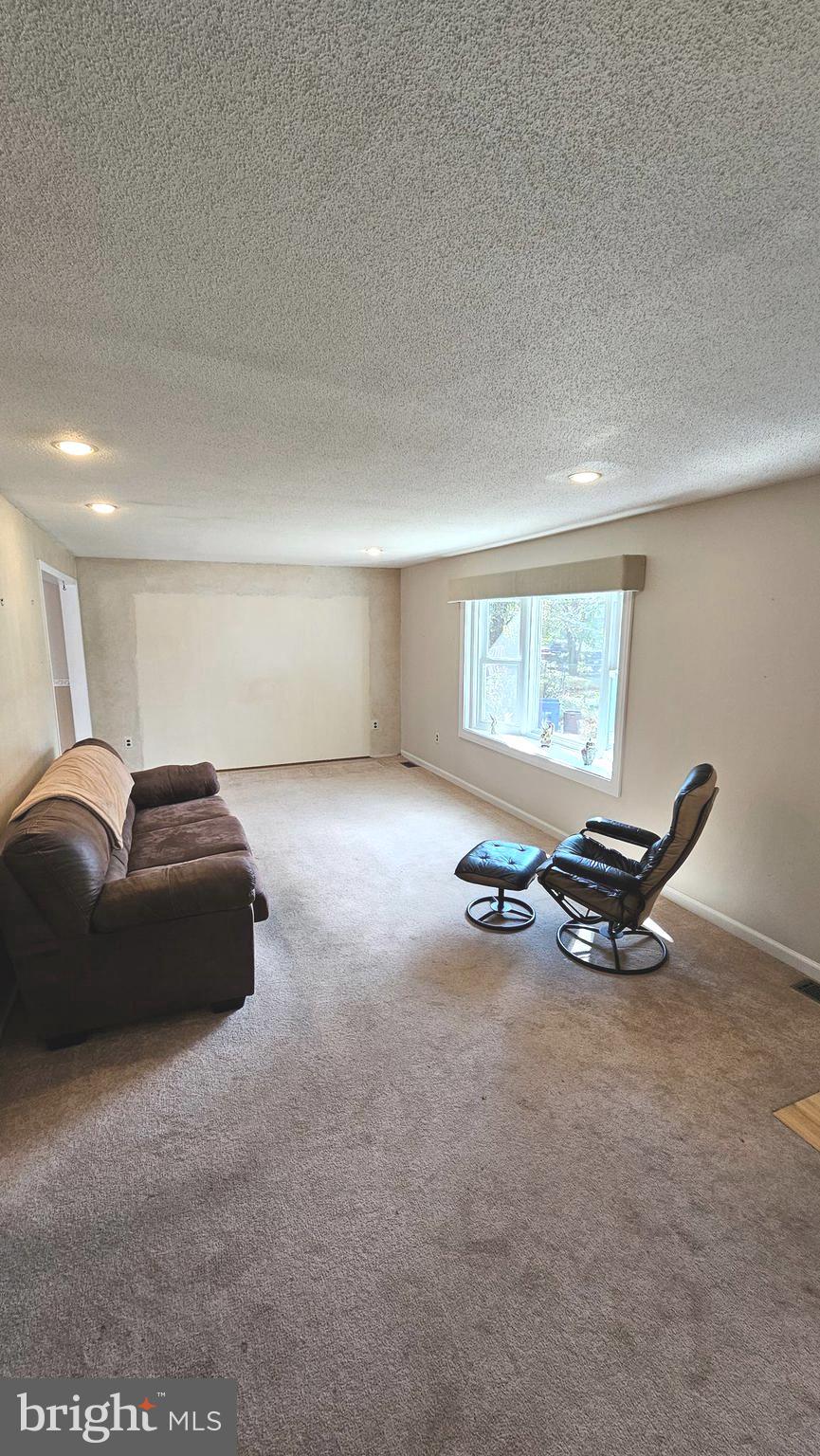 53 Crosswicks Chesterfield Road Chesterfield, NJ 08515 - Photo 6 of 35 a living room with furniture a window and a rug