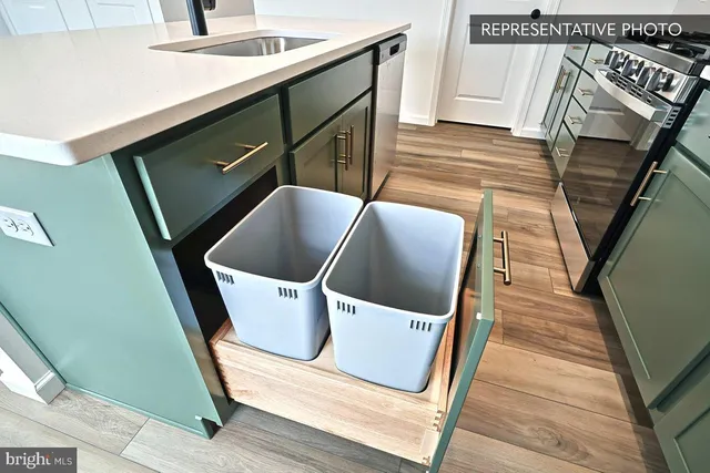 a view of washer and dryer with wooden floor