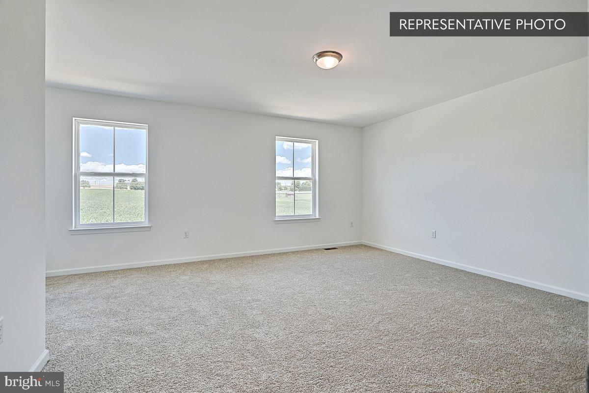 Black Cherry Plan At Hills Spring Grove, PA 17362 - Photo 27 of 42 an empty room with windows