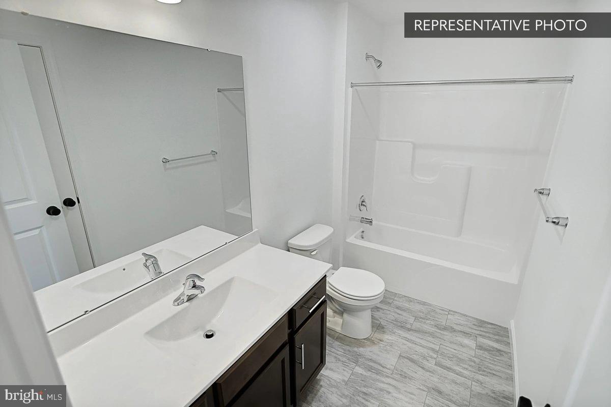 Black Cherry Plan At Hills Spring Grove, PA 17362 - Photo 36 of 42 a bathroom with a sink toilet and shower