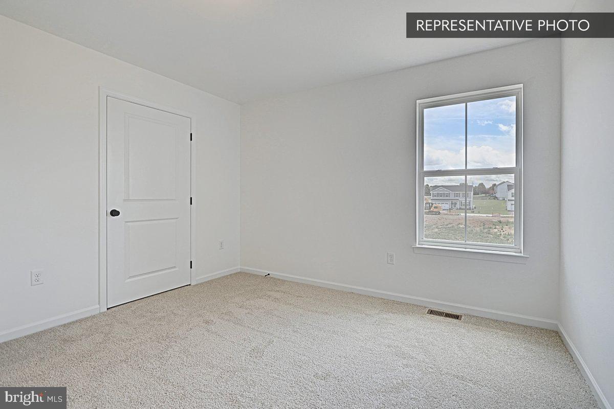 Black Cherry Plan At Hills Spring Grove, PA 17362 - Photo 42 of 42 a view of an empty room with a window