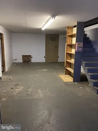 a view of an empty room and stairs