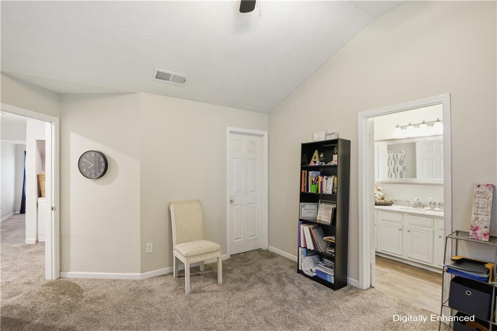 2555 Flat Shoals Road, Unit 2008 Atlanta, GA 30349 - Photo 19 of 33 a living room with furniture and a chair