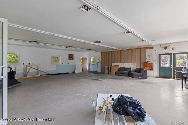 a view of a livingroom with furniture and windows