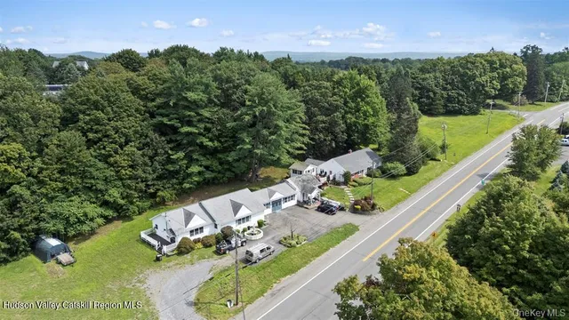 an aerial view of a house with a yard