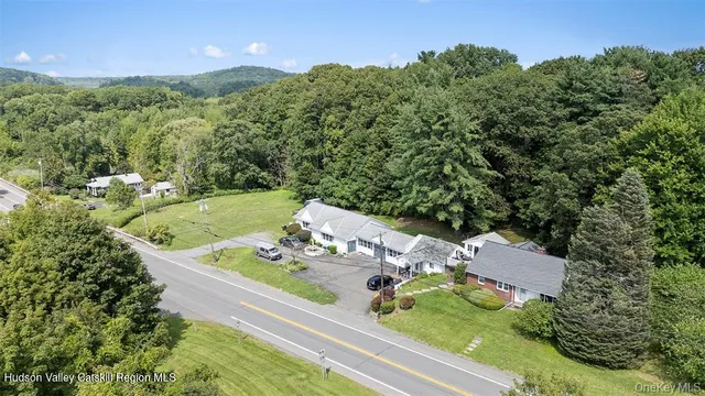 an aerial view of a house with yard swimming pool and outdoor seating