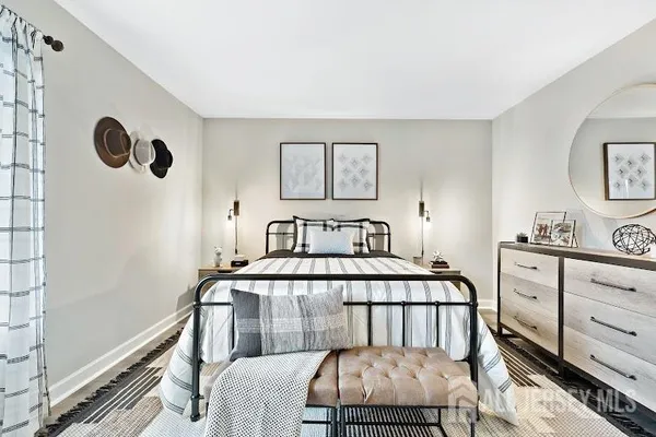 a bedroom with a bed and a dresser