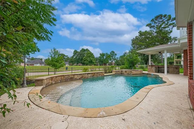 a view of a patio with a table chairs and a backyard