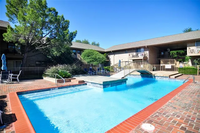a view of a house with swimming pool