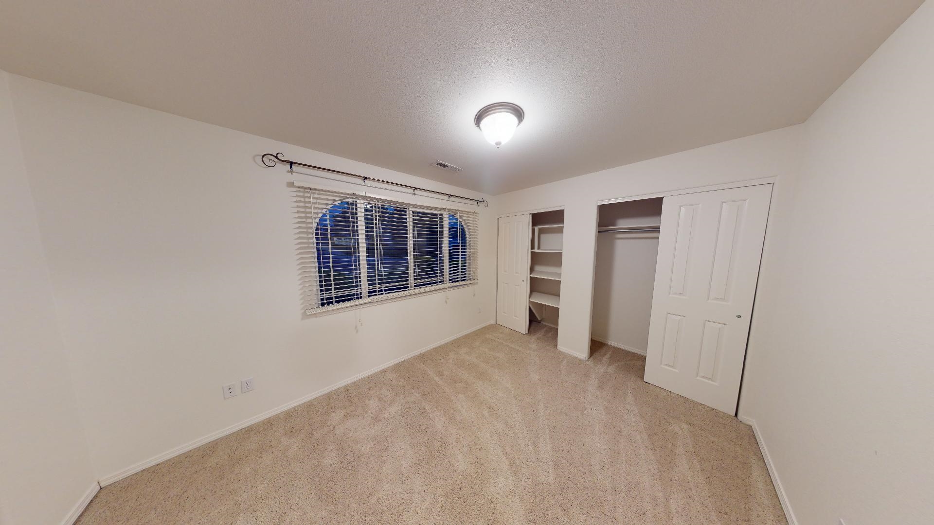 210 Limestone Circle Grand Junction, CO 81503 - Photo 12 of 32 a view of an empty room with a window