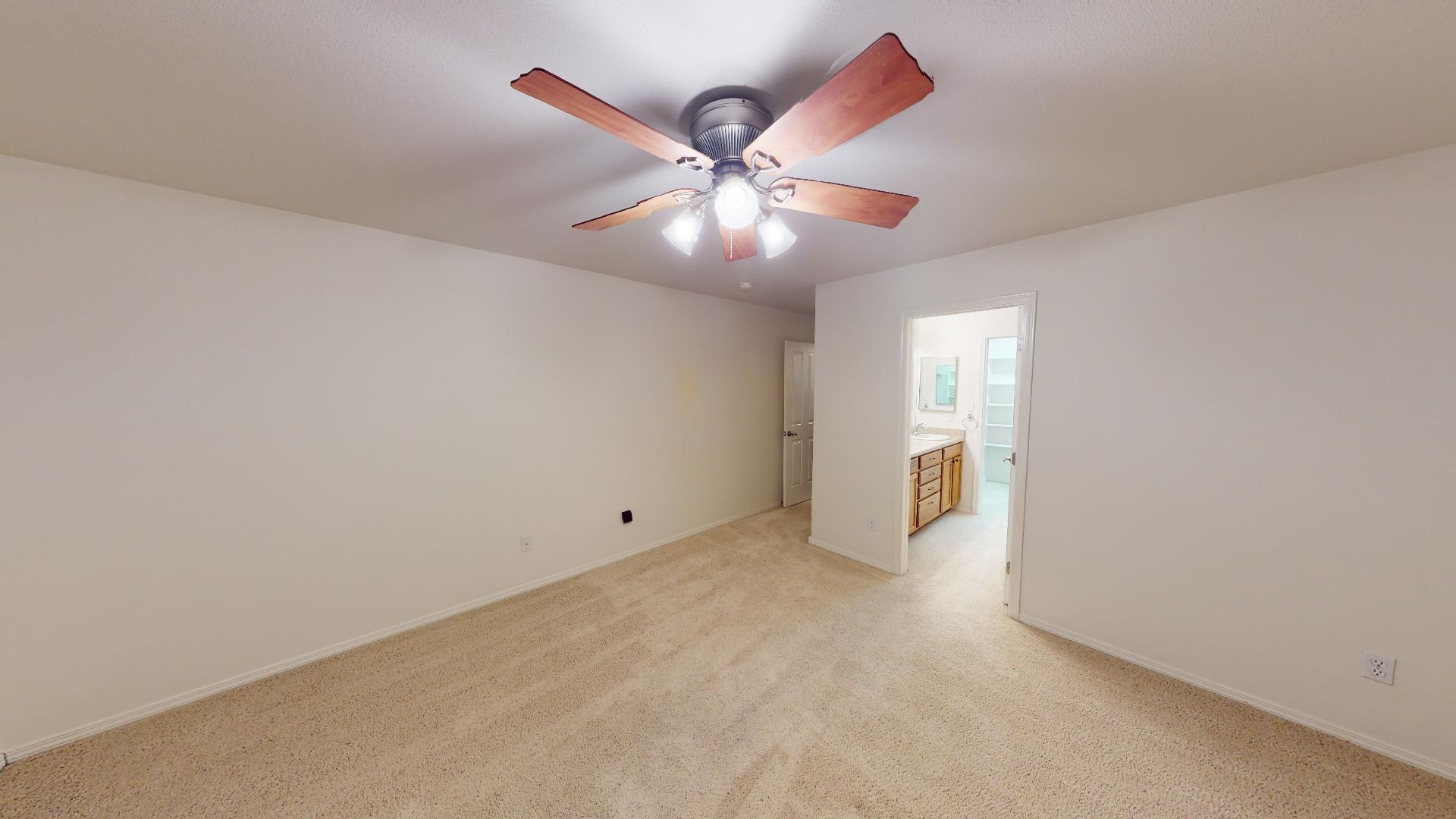 210 Limestone Circle Grand Junction, CO 81503 - Photo 14 of 32 a view of an empty room and chandelier fan