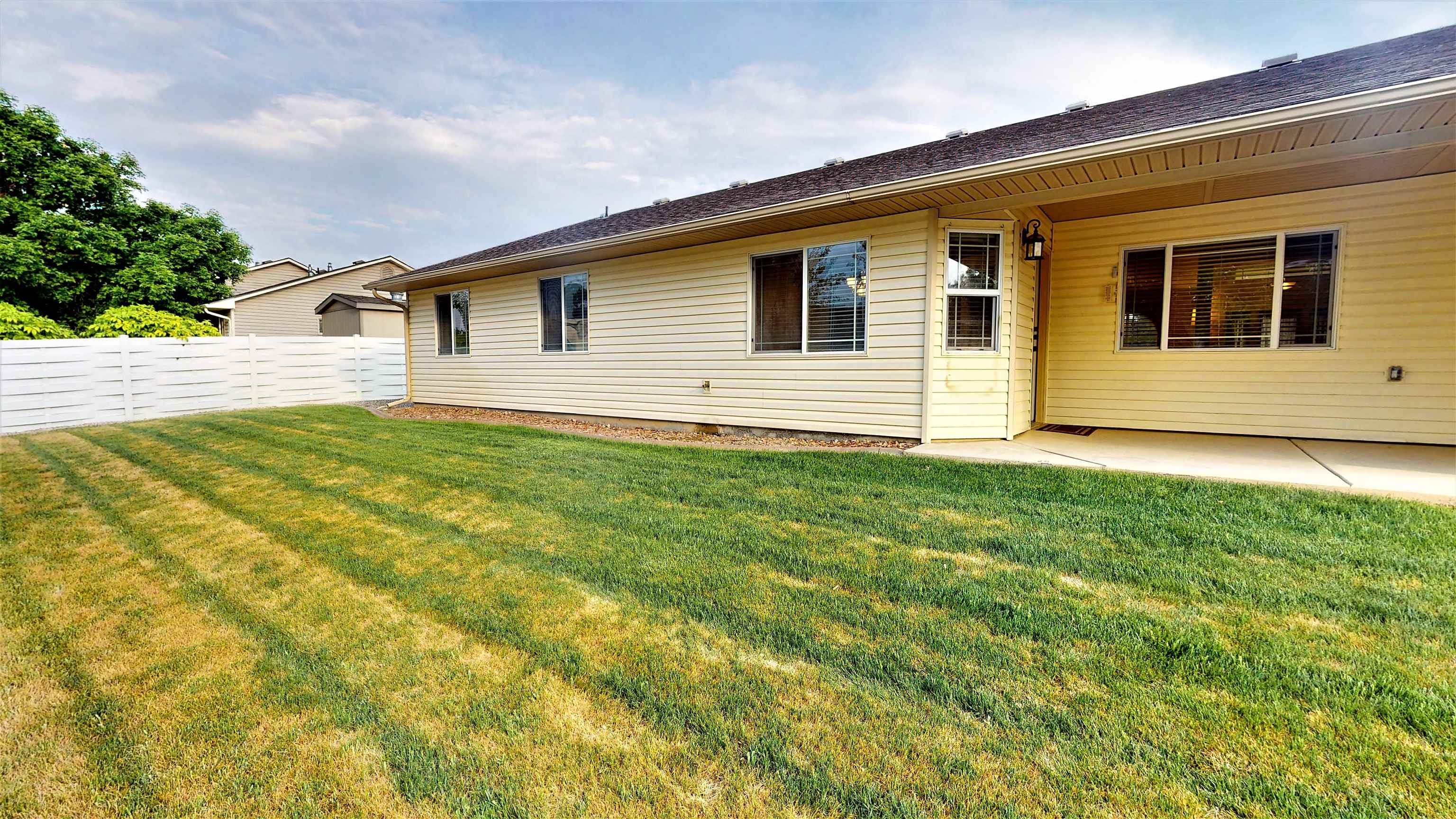 210 Limestone Circle Grand Junction, CO 81503 - Photo 22 of 32 a view of a house with a yard