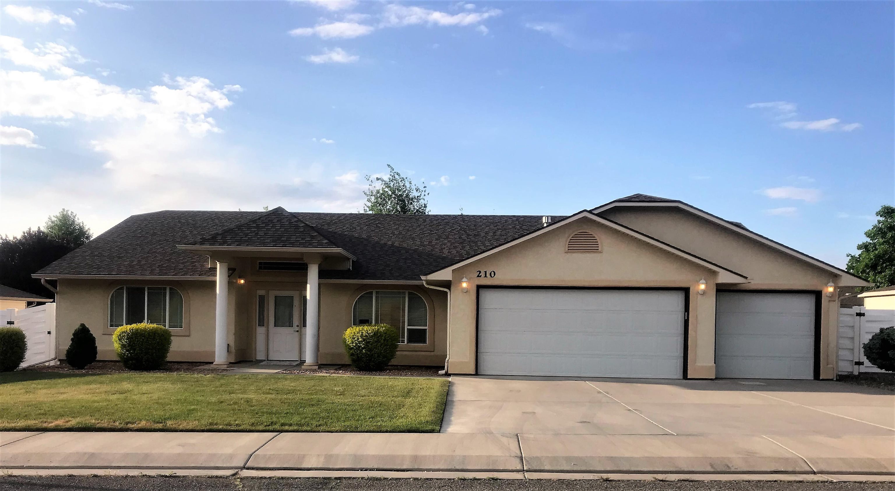 210 Limestone Circle Grand Junction, CO 81503 - Photo 29 of 32 a front view of a house with a yard