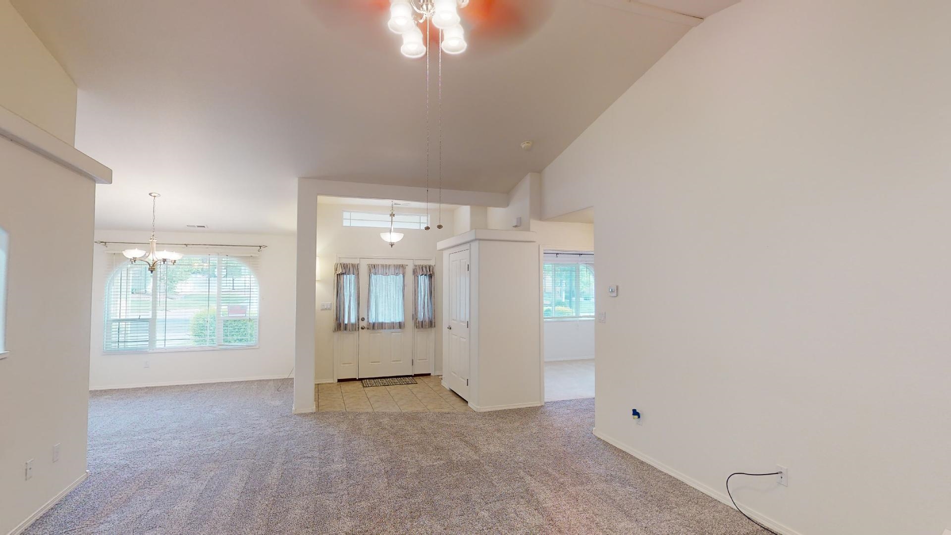 210 Limestone Circle Grand Junction, CO 81503 - Photo 3 of 32 an empty room with windows and entrance