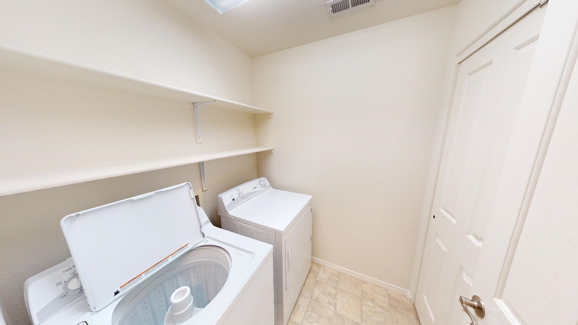 210 Limestone Circle Grand Junction, CO 81503 - Photo 7 of 32 a utility room with dryer and washer