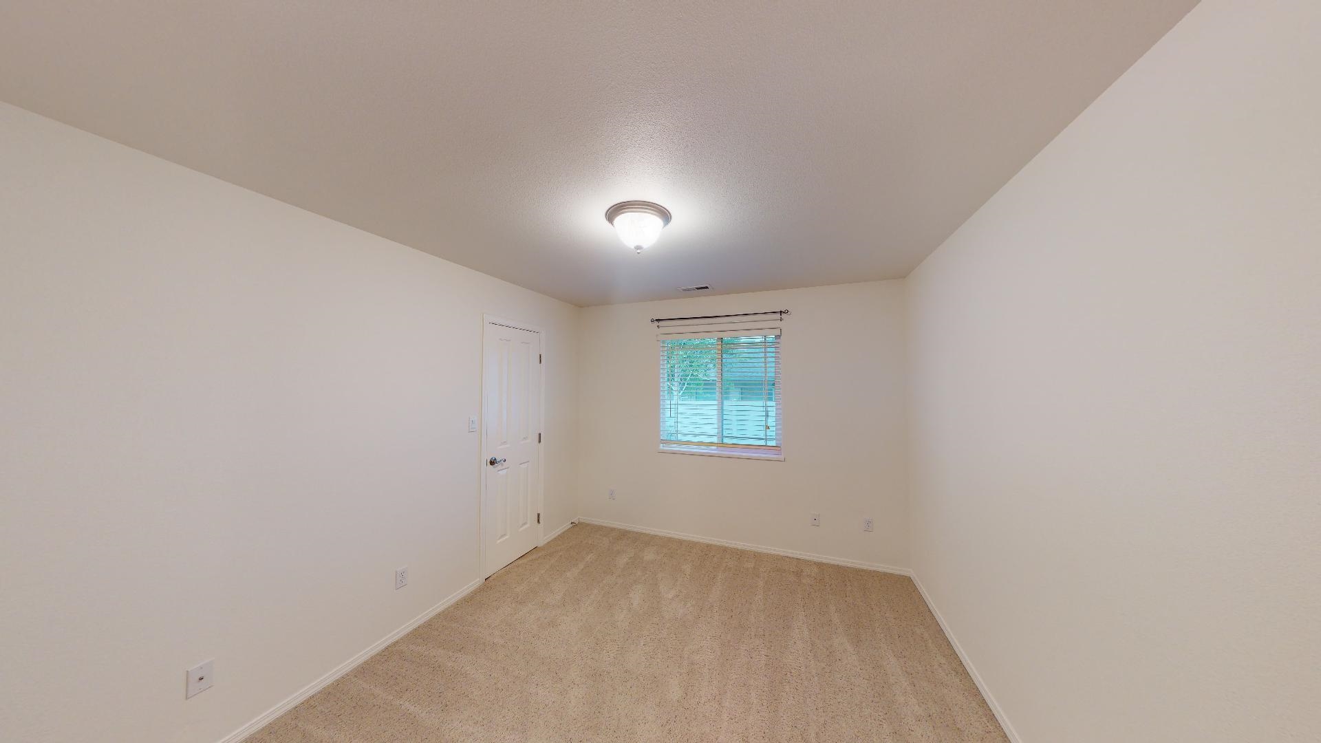 210 Limestone Circle Grand Junction, CO 81503 - Photo 8 of 32 an empty room with a window