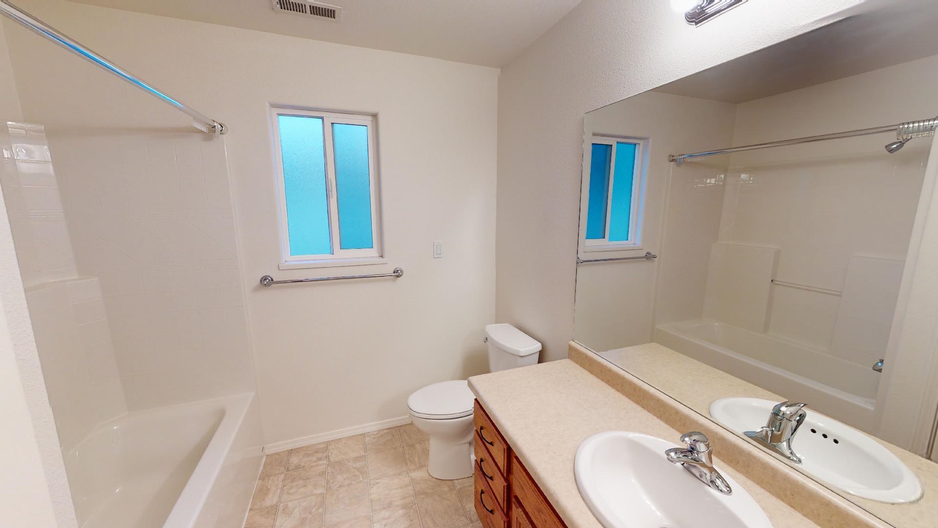 210 Limestone Circle Grand Junction, CO 81503 - Photo 10 of 32 a bathroom with a sink a toilet and shower