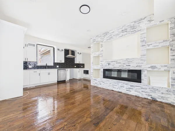 a kitchen with stainless steel appliances granite countertop a sink and cabinets