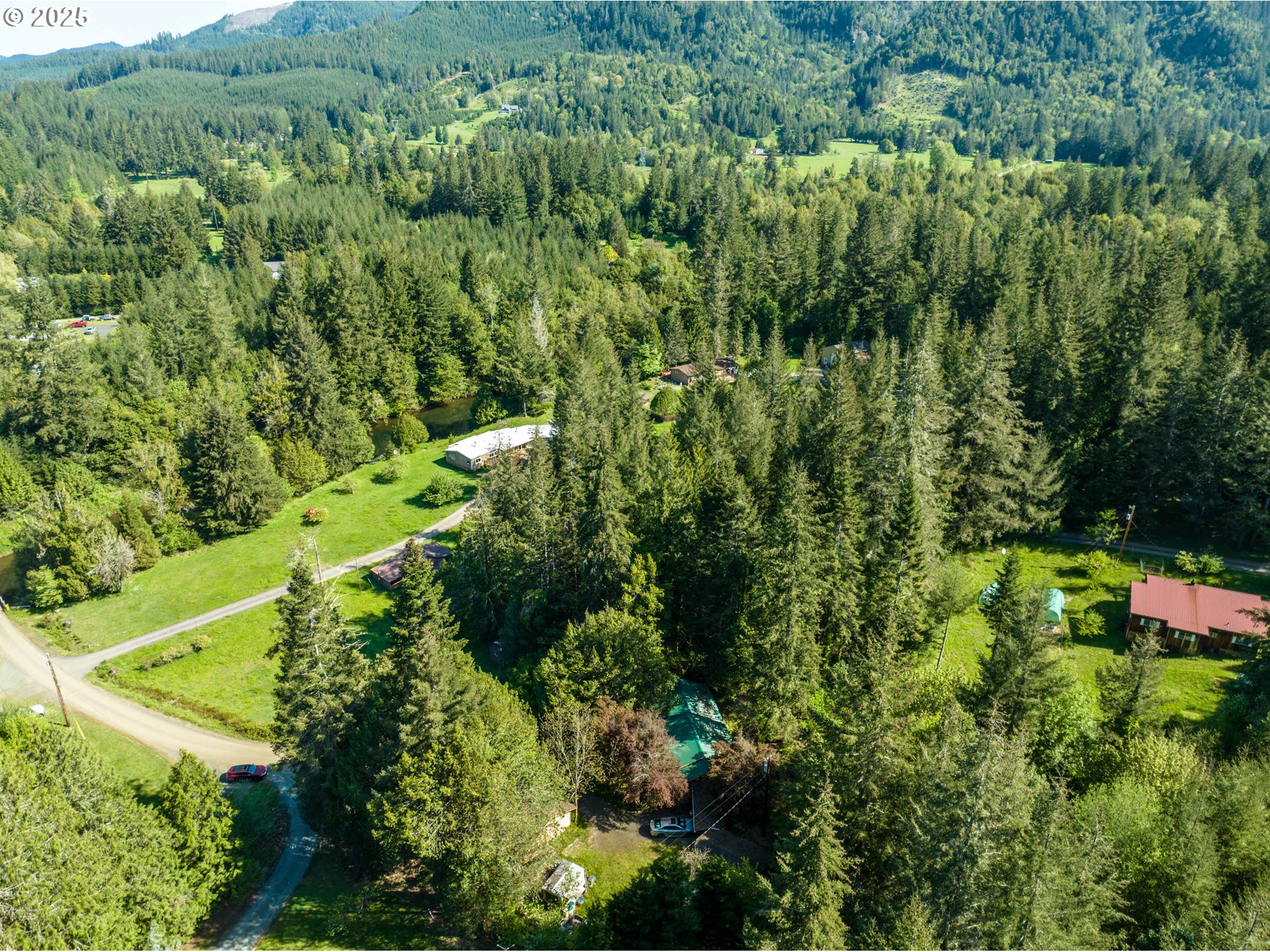56010 Gold Brick Road Myrtle Point, OR 97458 - Photo 13 of 27 an aerial view of residential house with outdoor space and trees all around