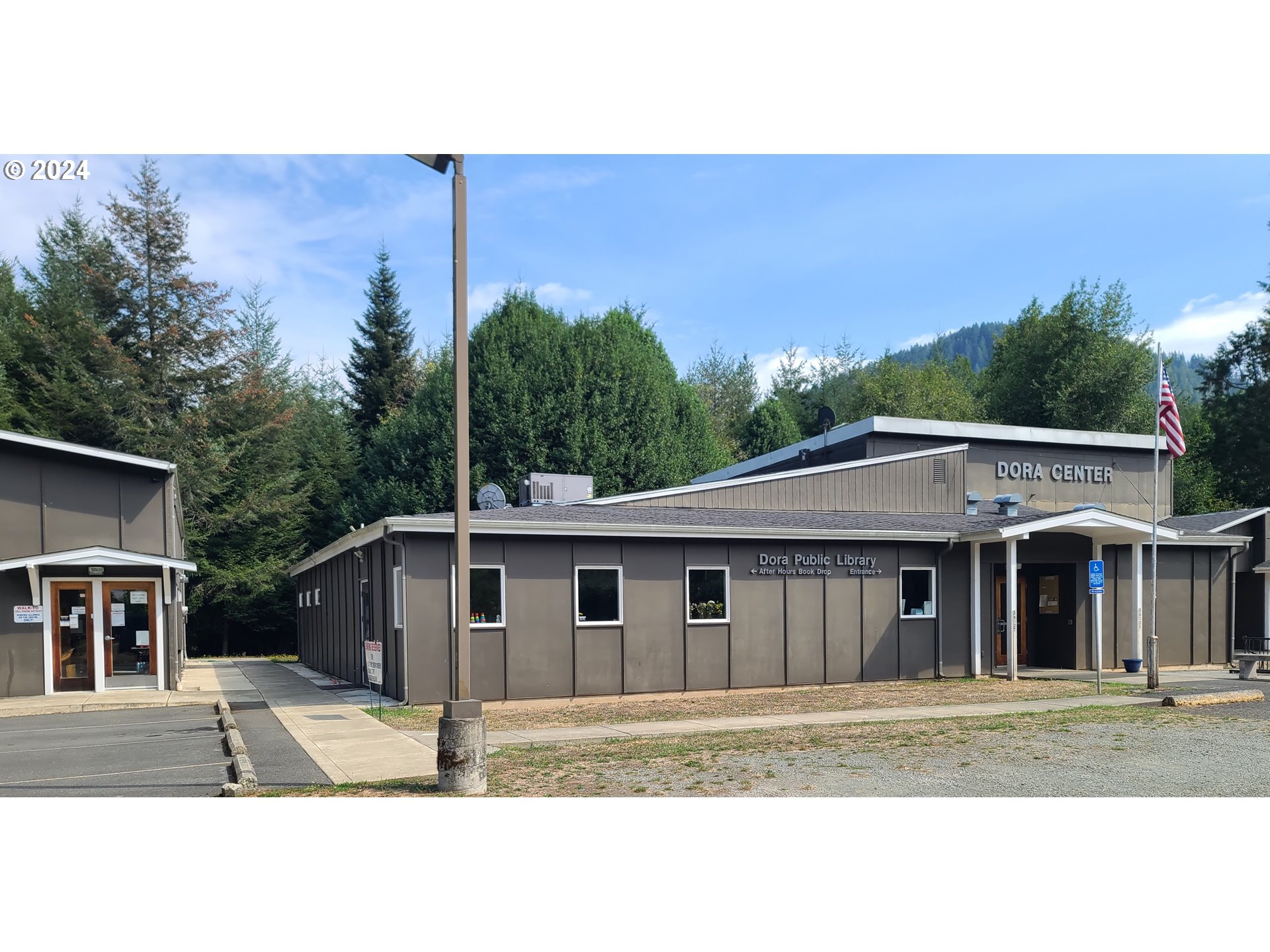 56010 Gold Brick Road Myrtle Point, OR 97458 - Photo 5 of 27 a house with trees in the background