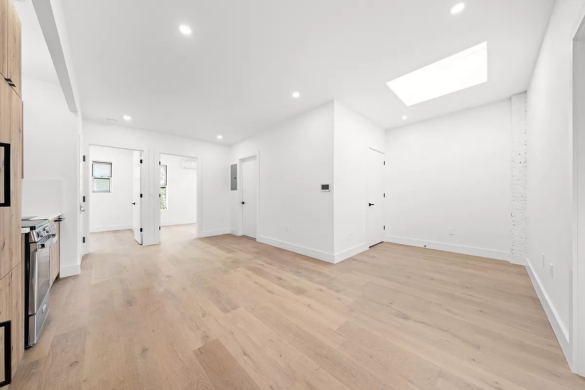 an empty room with white walls and white walls