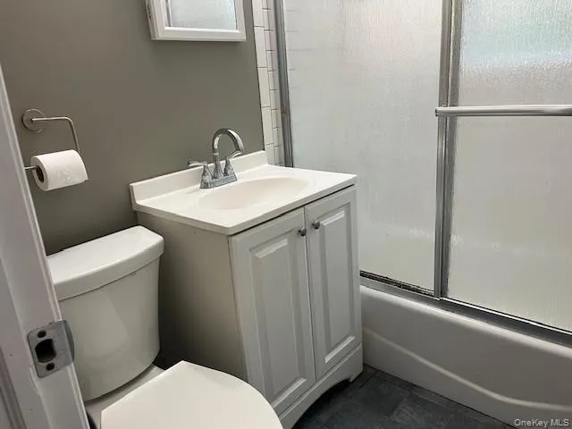 a bathroom with a sink mirror and vanity