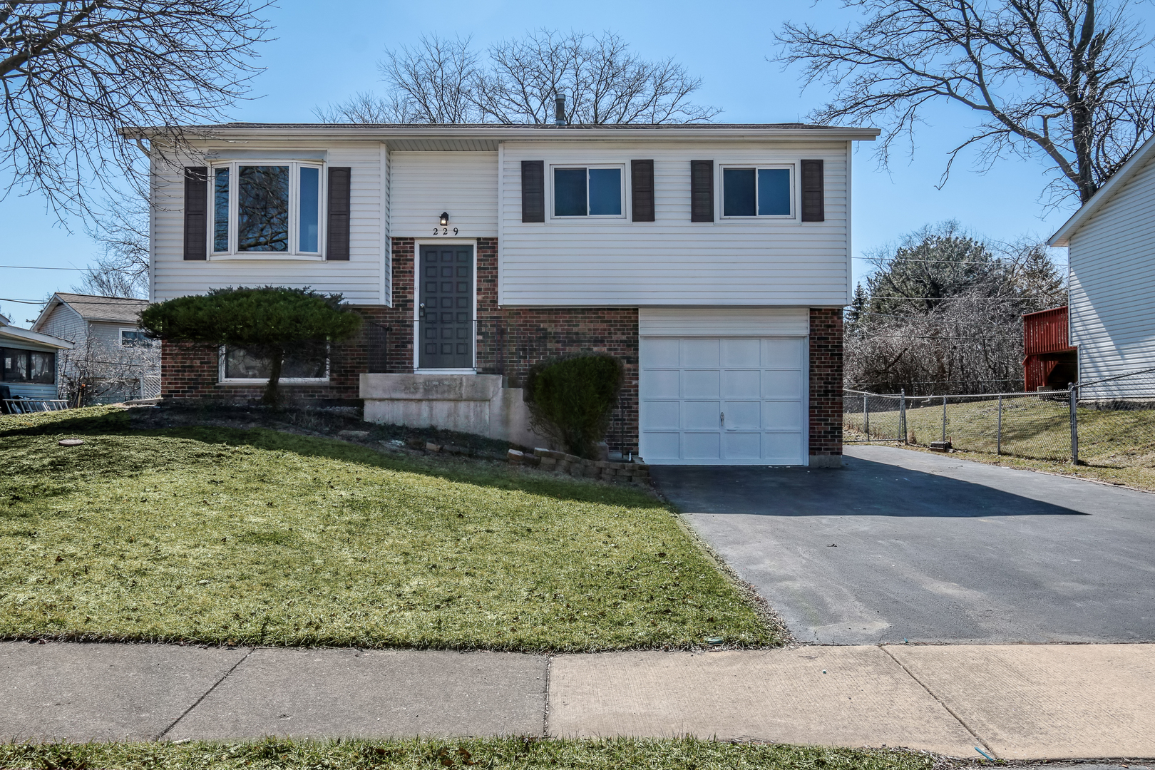 229 Riverside Drive Bolingbrook, IL 60440 - Photo 2 of 35 front view of a house with a yard
