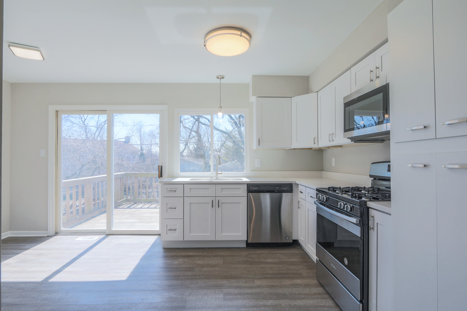 229 Riverside Drive Bolingbrook, IL 60440 - Photo 11 of 35 a kitchen with stainless steel appliances granite countertop a stove a sink and a white cabinets