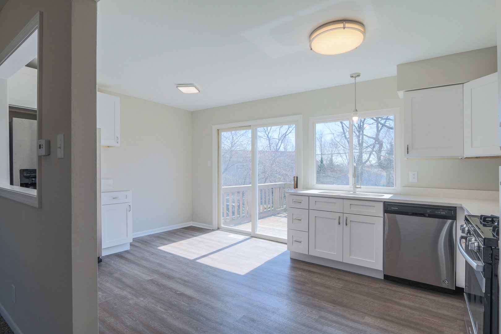 229 Riverside Drive Bolingbrook, IL 60440 - Photo 12 of 35 a large kitchen with wooden floor and window
