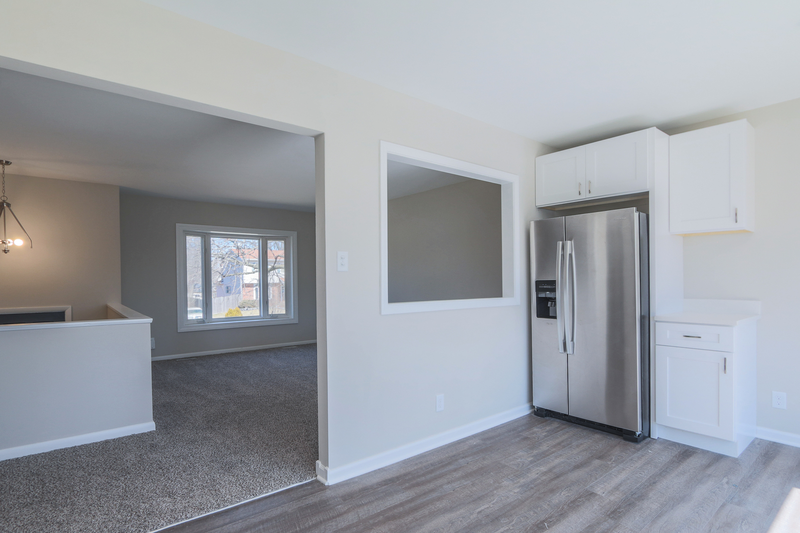 229 Riverside Drive Bolingbrook, IL 60440 - Photo 14 of 35 an empty room with wooden floor and windows