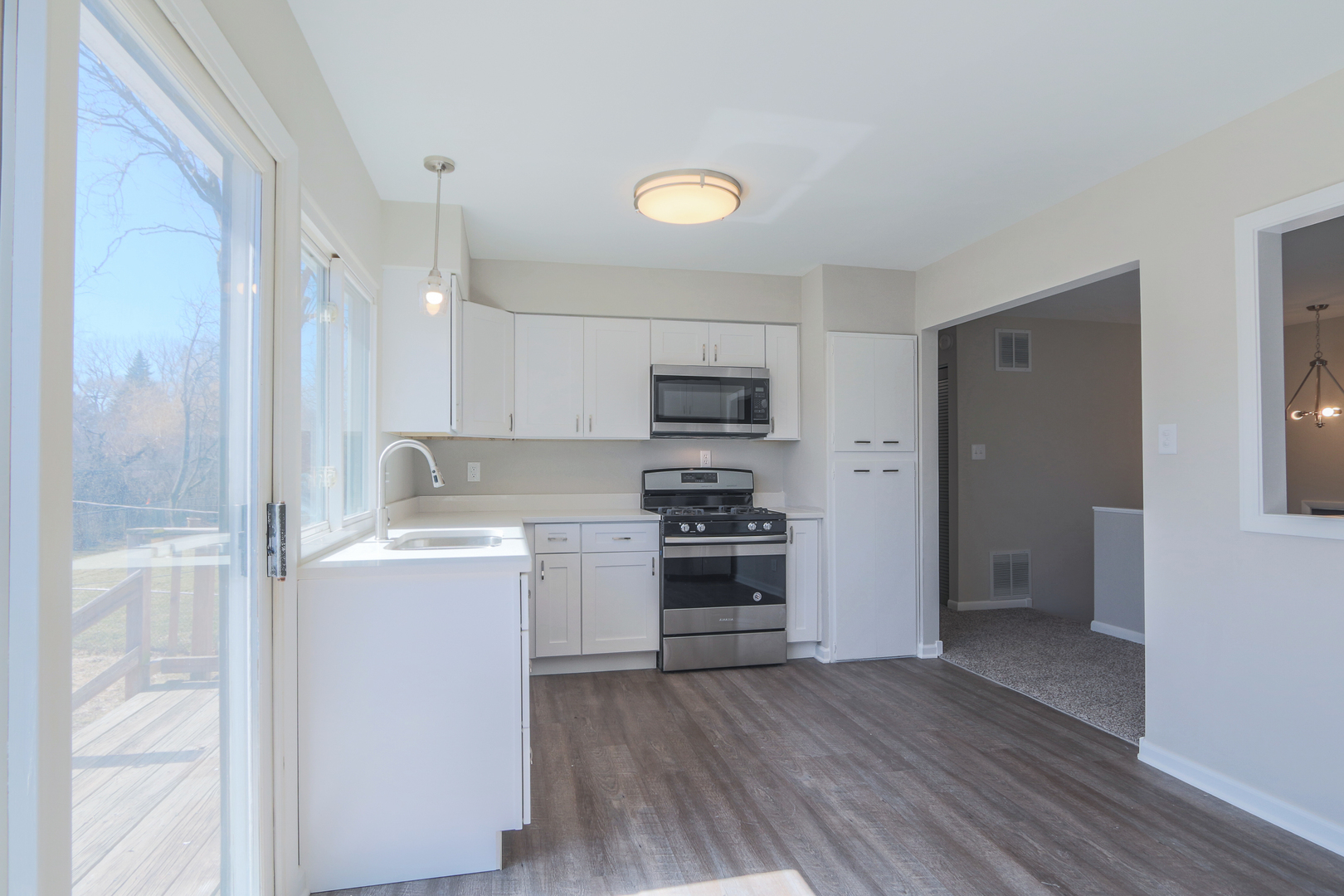 229 Riverside Drive Bolingbrook, IL 60440 - Photo 15 of 35 a kitchen with a refrigerator and a stove top oven