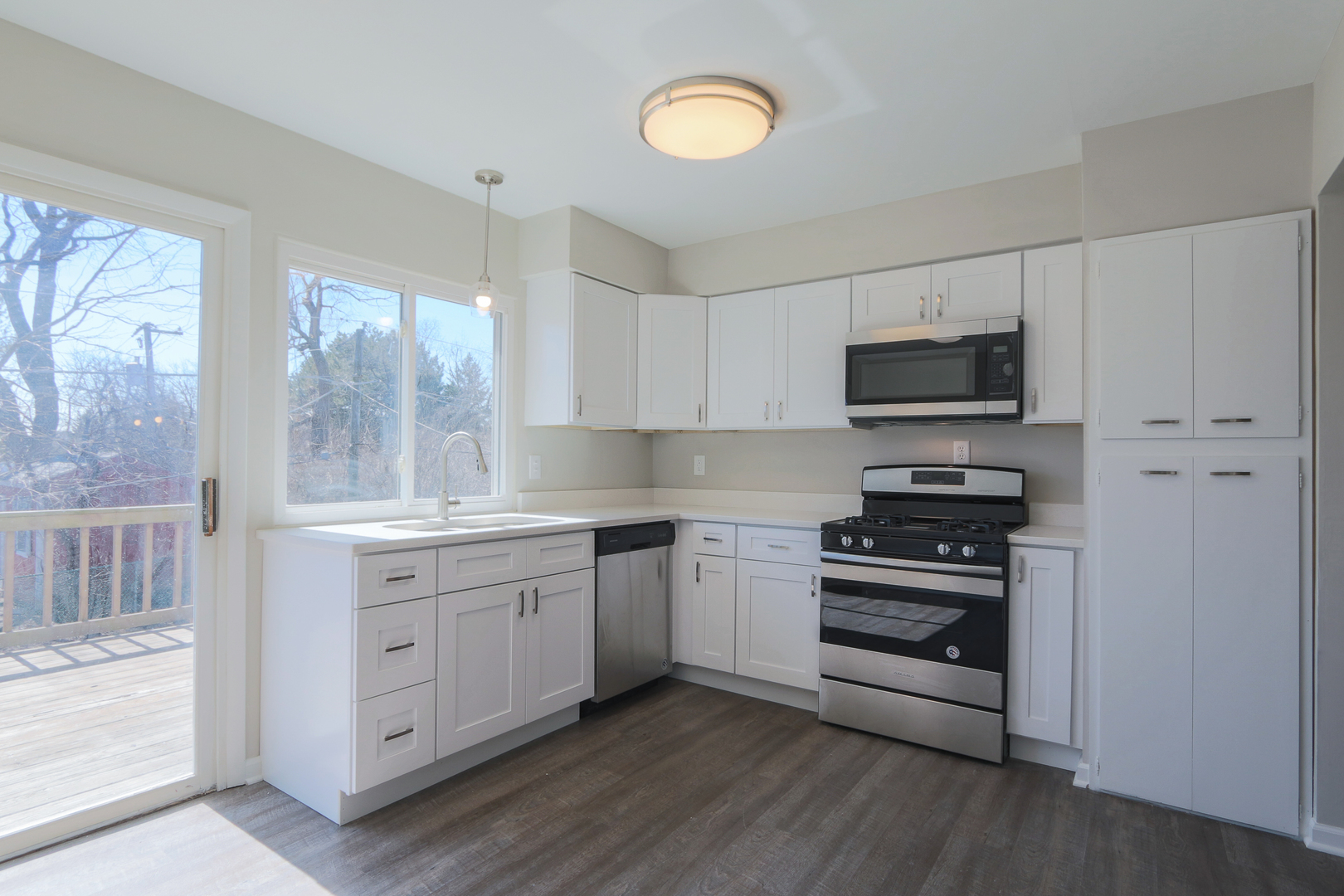 229 Riverside Drive Bolingbrook, IL 60440 - Photo 16 of 35 a kitchen with appliances cabinets a sink and a window