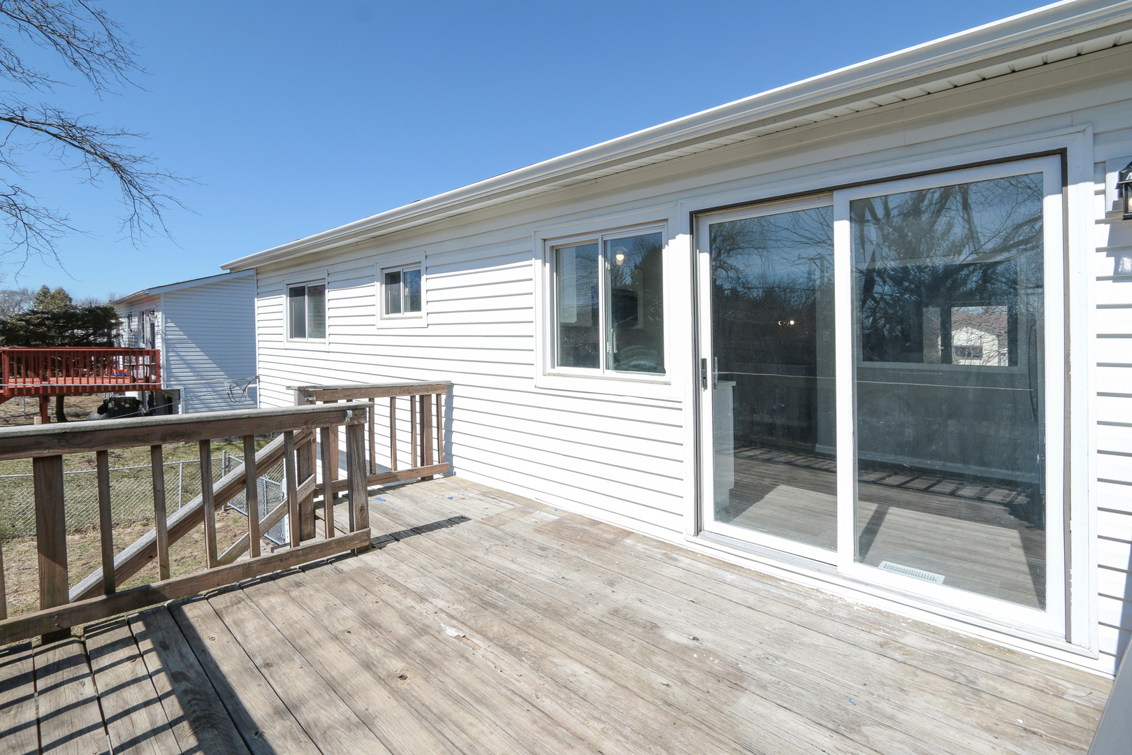 229 Riverside Drive Bolingbrook, IL 60440 - Photo 30 of 35 a view of a balcony with two chairs and wooden floor