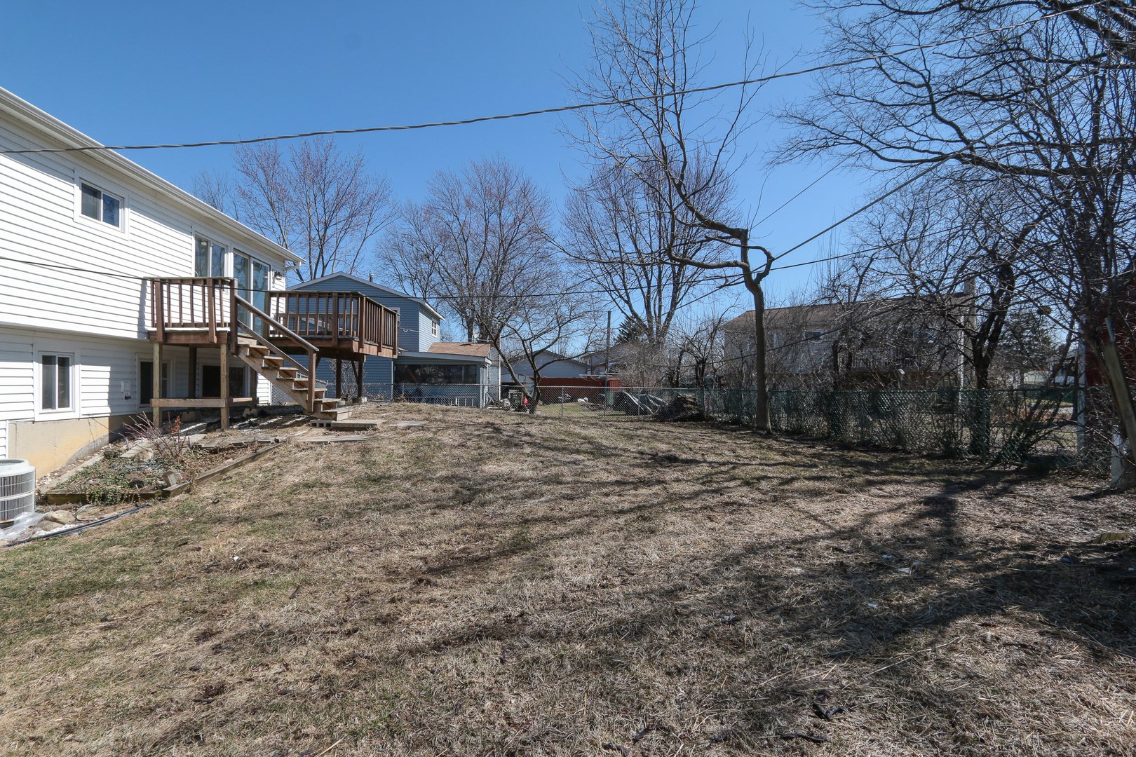 229 Riverside Drive Bolingbrook, IL 60440 - Photo 33 of 35 a backyard of a house with large trees and outdoor seating