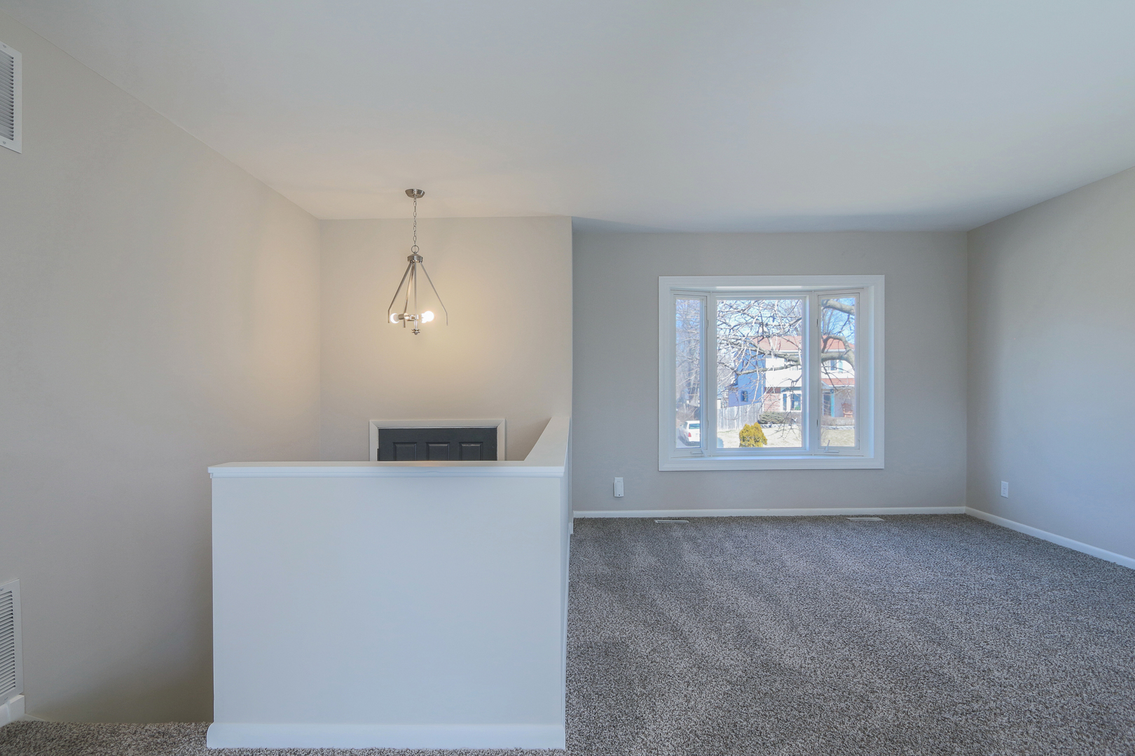 229 Riverside Drive Bolingbrook, IL 60440 - Photo 6 of 35 an empty room with windows and cabinet