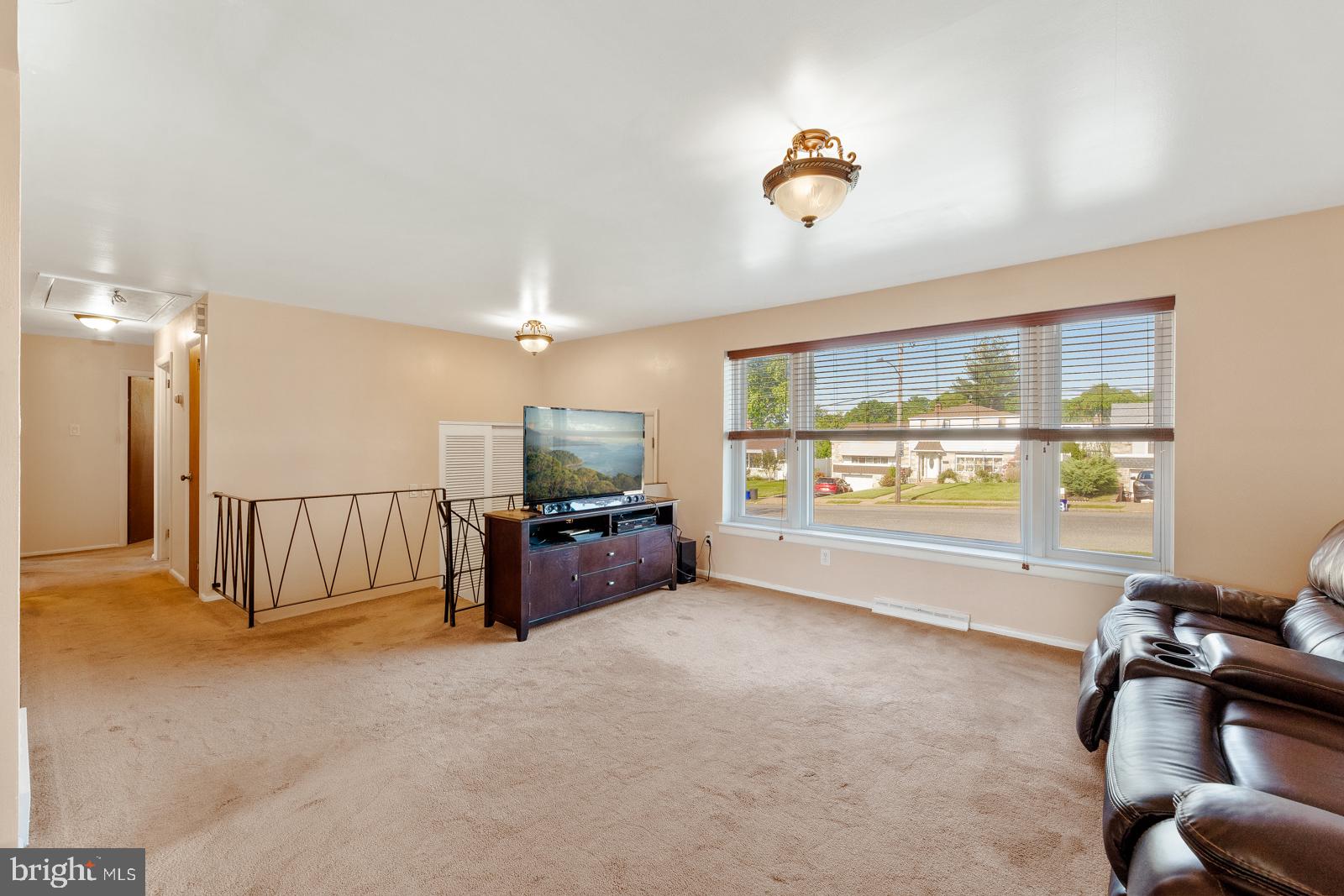 823 Rennard Street Philadelphia, PA 19116 - Photo 6 of 40 Spacious living area with natural light.