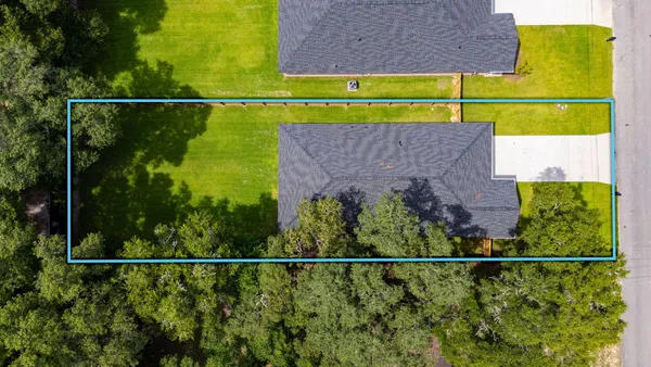 a kitchen with kitchen island a sink stainless steel appliances and white cabinets