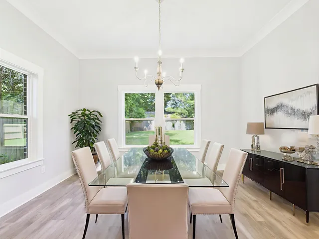 a dining room with furniture and window