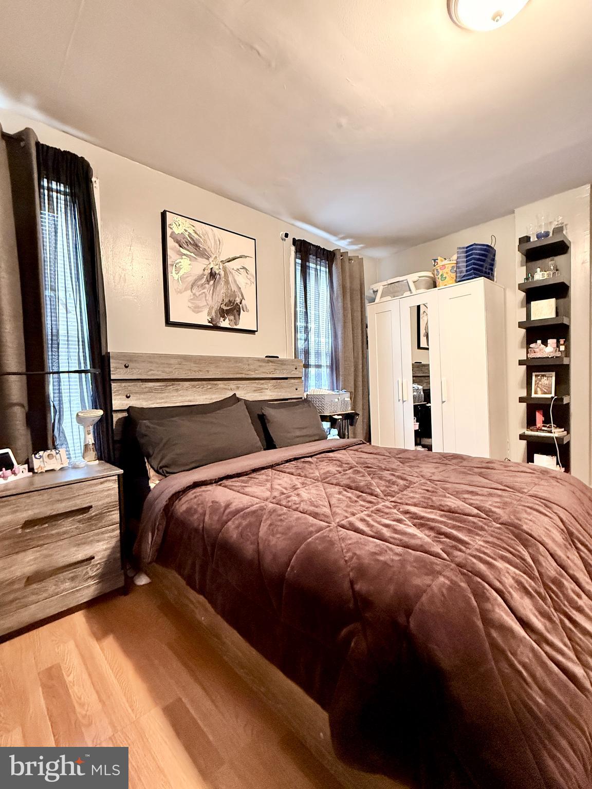 1157 Chestnut Street Camden, NJ 08103 - Photo 14 of 17 a bed sitting in a bedroom next to a window