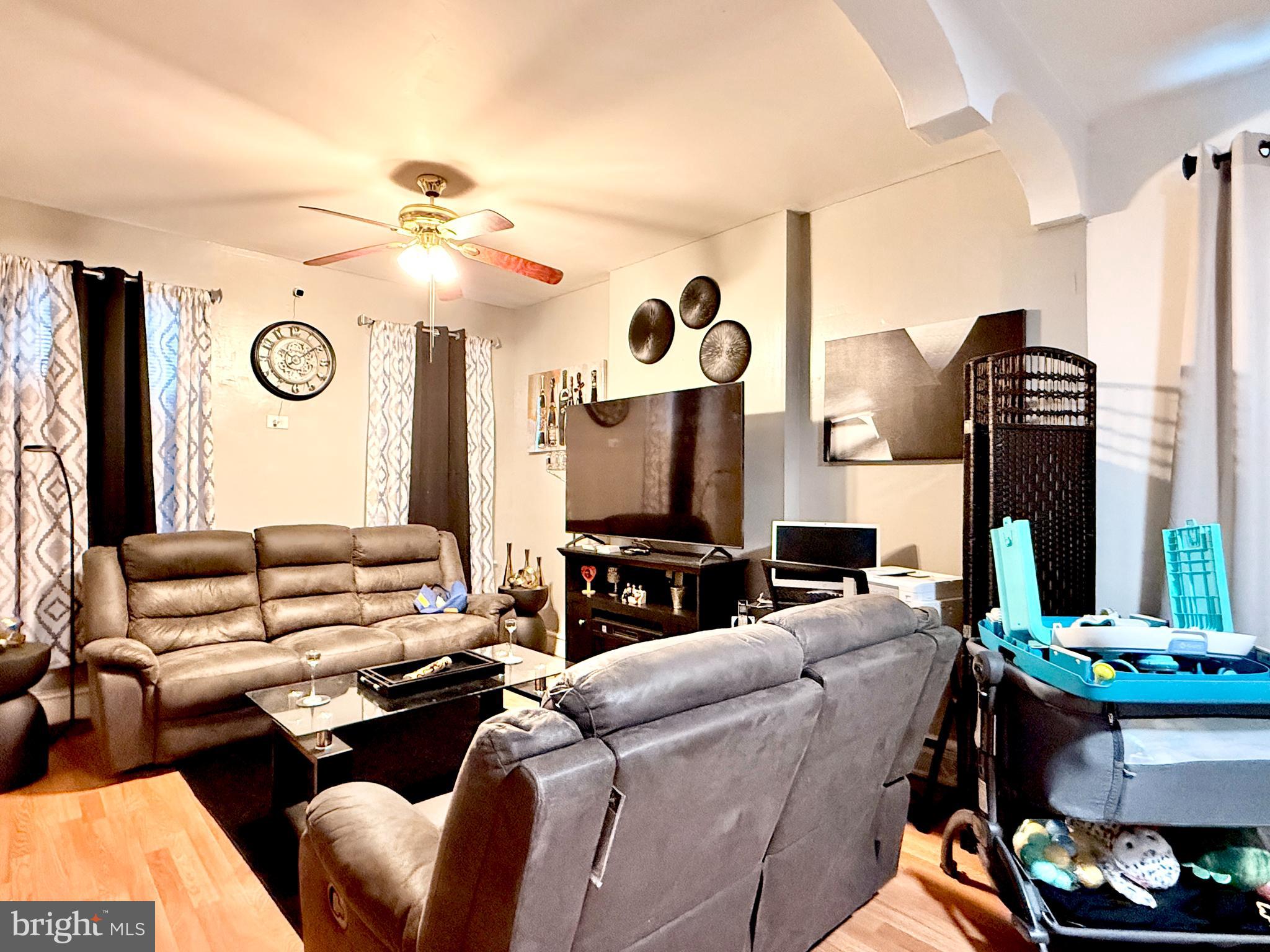 1157 Chestnut Street Camden, NJ 08103 - Photo 4 of 17 a living room with furniture and a fireplace