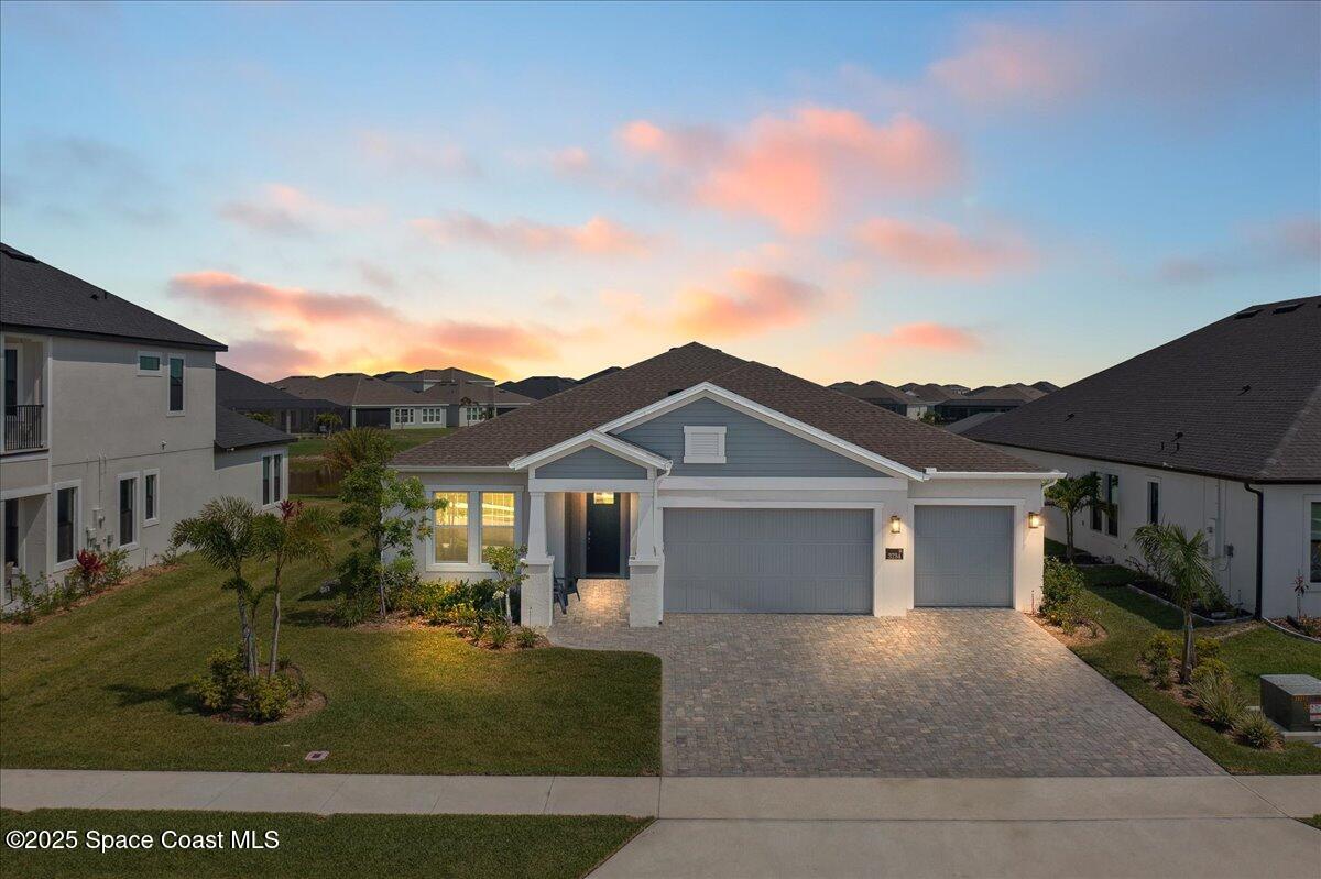 3234 Laming Way Melbourne, FL 32940 - Photo 1 of 59 a view of a big house with a big yard and potted plants