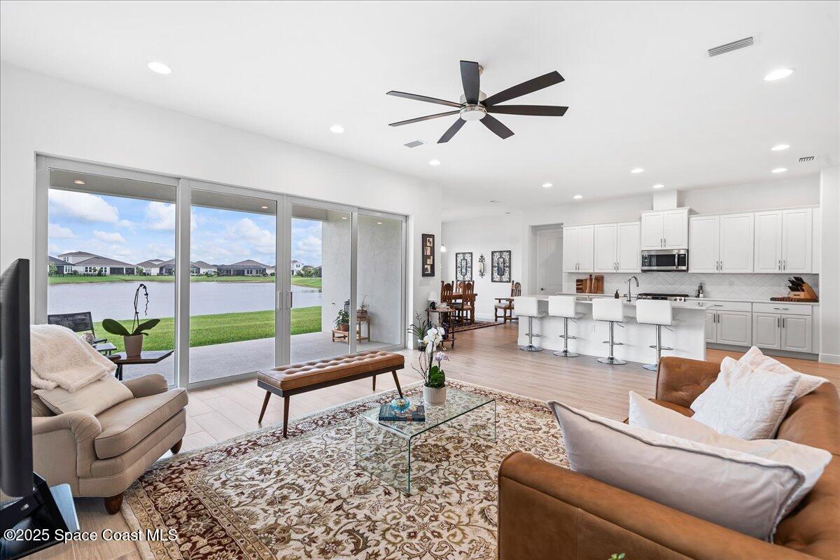 3234 Laming Way Melbourne, FL 32940 - Photo 17 of 59 a living room with furniture and a large window