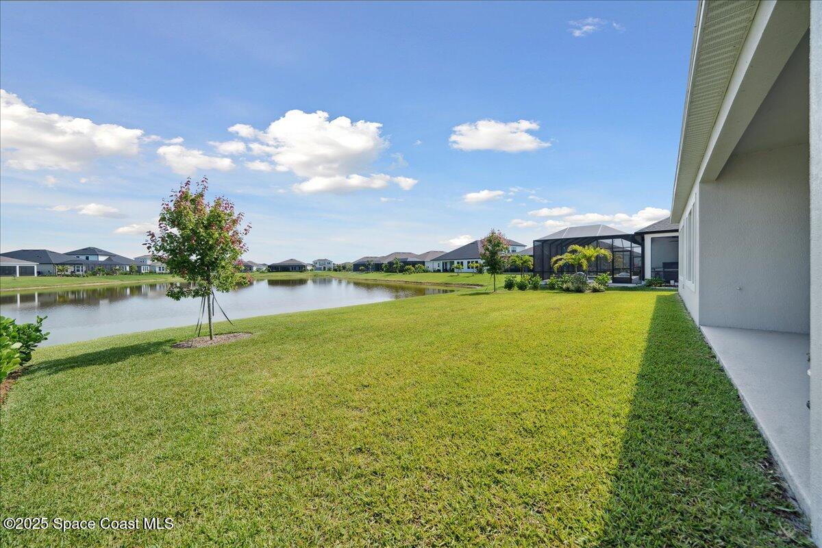 3234 Laming Way Melbourne, FL 32940 - Photo 44 of 59 a view of a lake with houses in the background