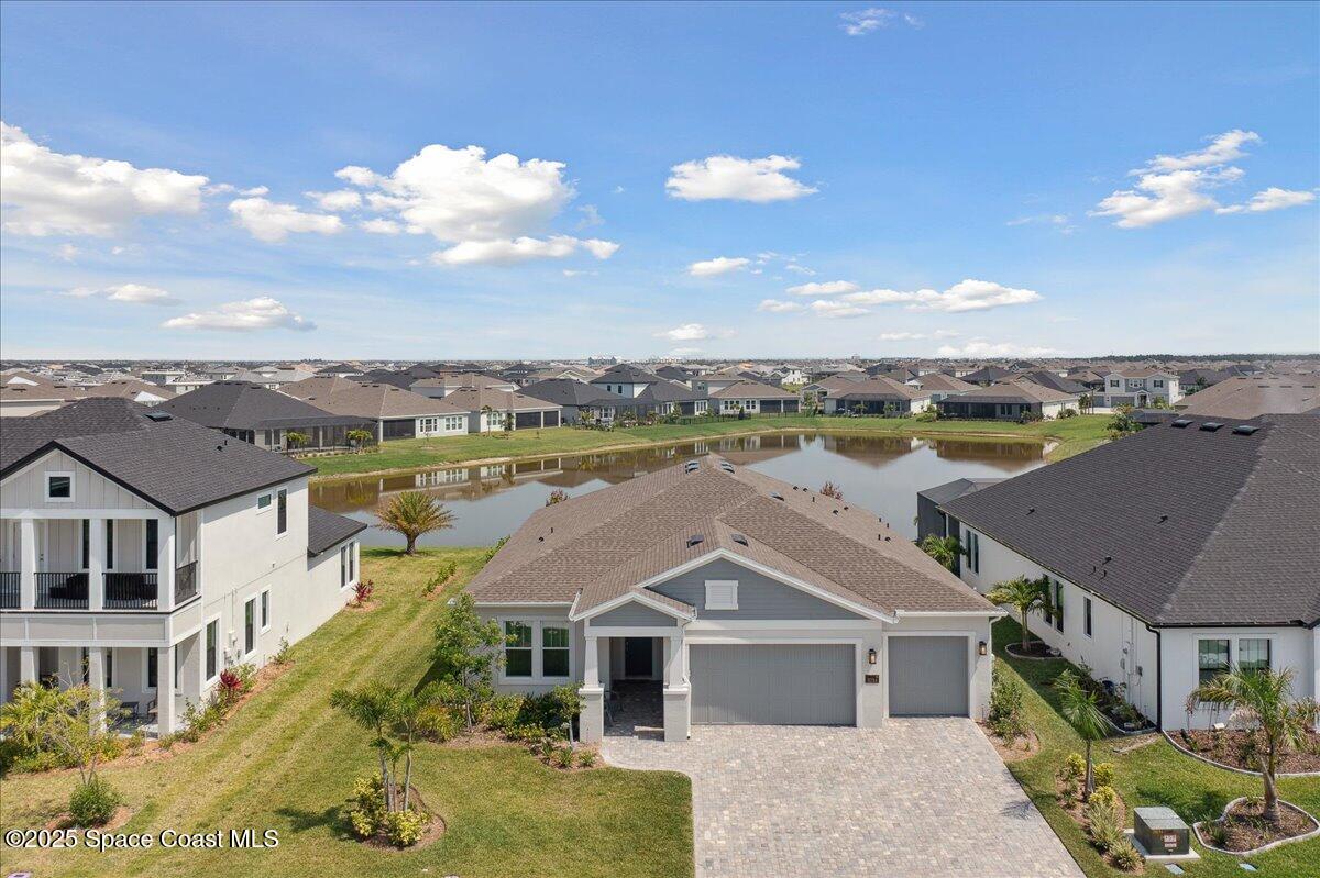3234 Laming Way Melbourne, FL 32940 - Photo 48 of 59 an aerial view of residential houses with outdoor space and ocean view