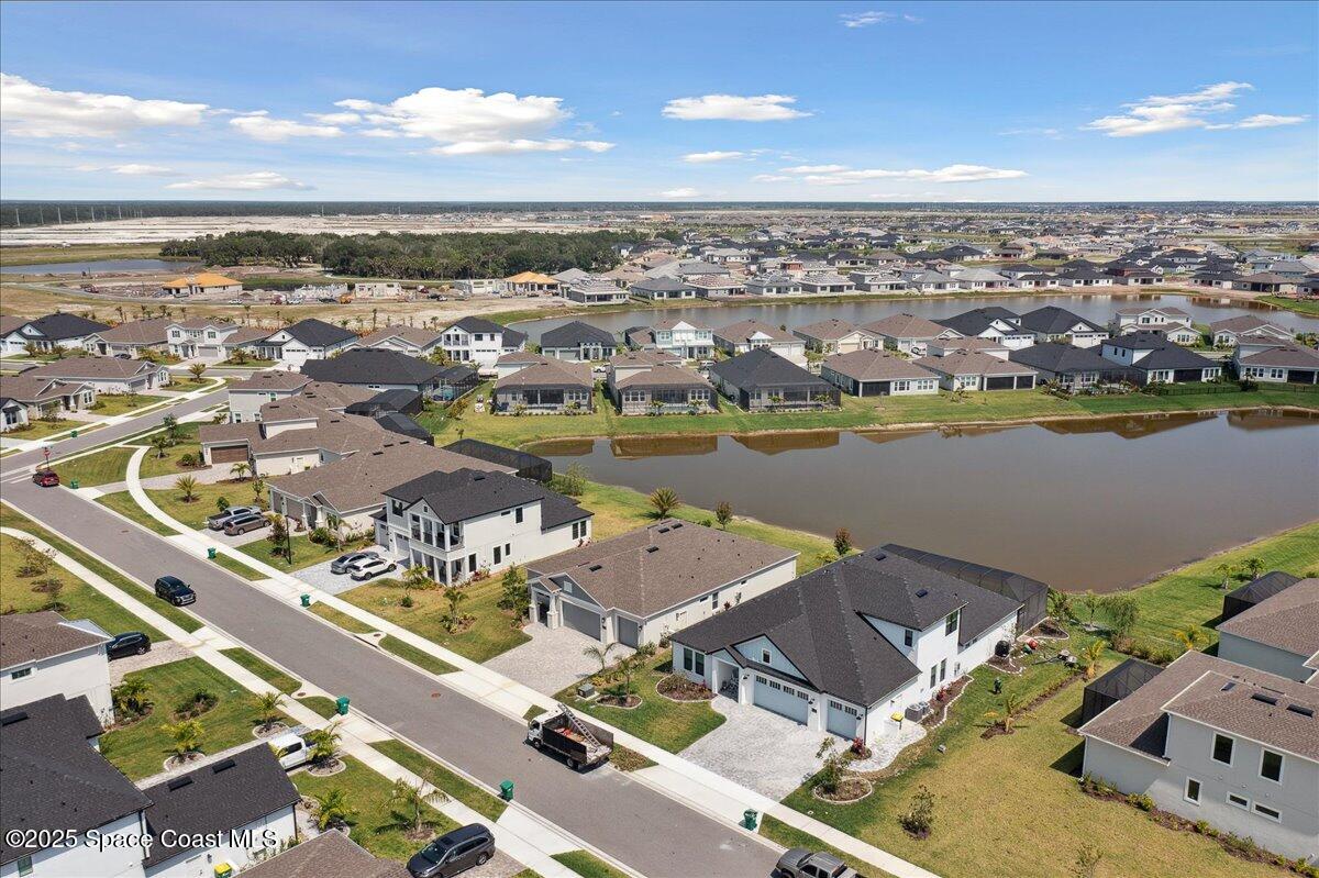 3234 Laming Way Melbourne, FL 32940 - Photo 52 of 59 an aerial view of a city with lake view
