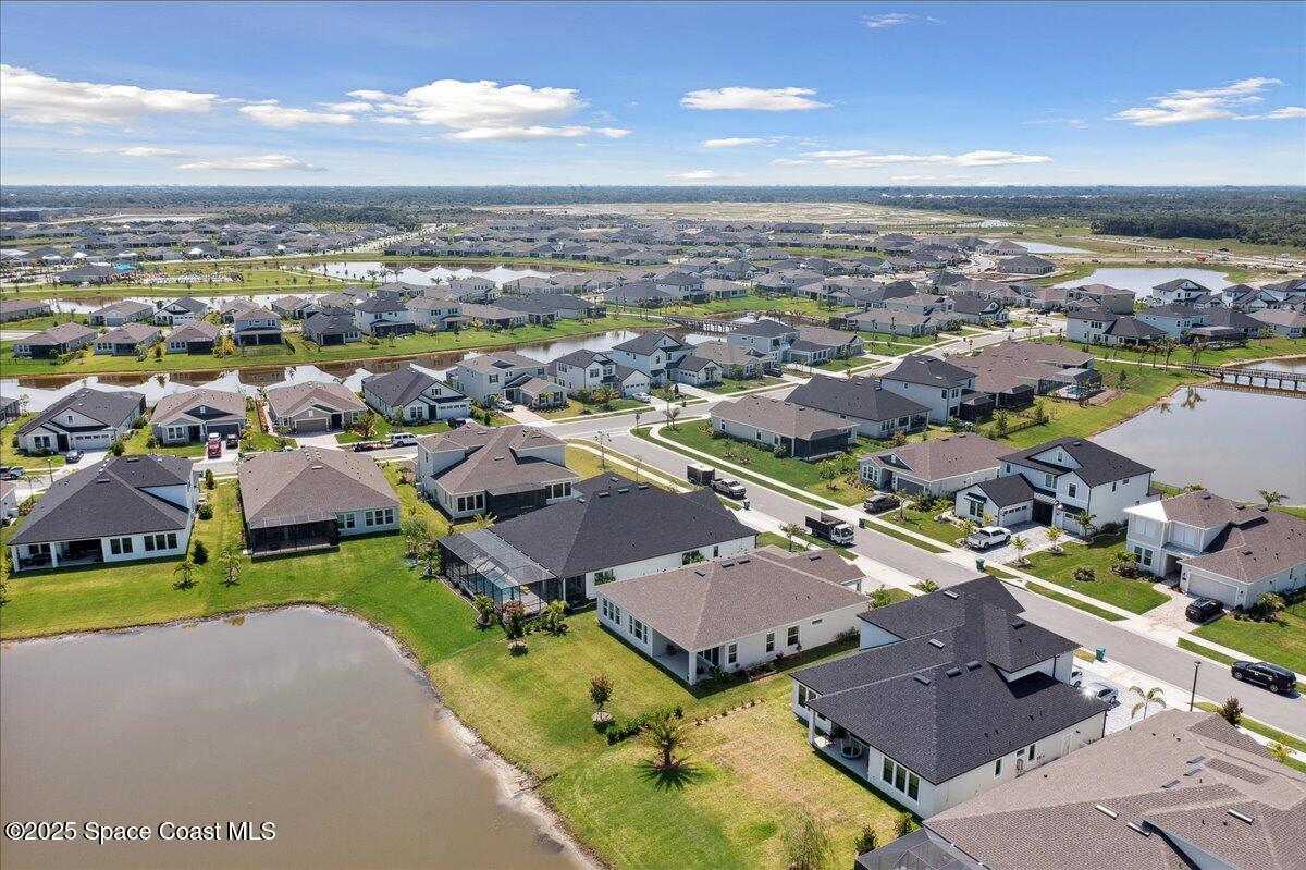 3234 Laming Way Melbourne, FL 32940 - Photo 55 of 59 an aerial view of a houses with a swimming pool