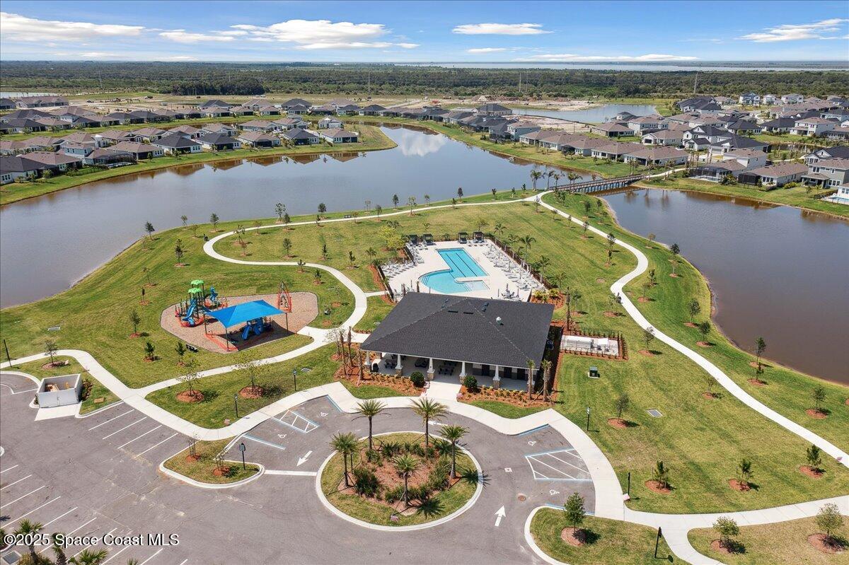 3234 Laming Way Melbourne, FL 32940 - Photo 56 of 59 an aerial view of a house with swimming pool and ocean view